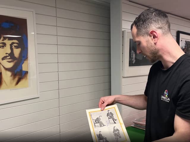 Omega Auctions manager Dan Hampton shows us some of The Beatles lots.