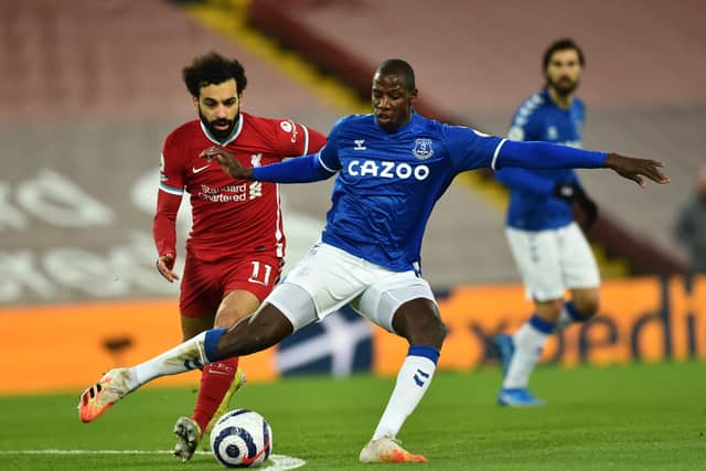 Liverpool forward battles Abdoulaye Doucoure for the ball during Everton’s 2-0 Merseyside derby win at Anfield in February 2021. Picture: Andrew Powell/Liverpool FC via Getty Images
