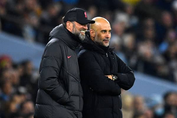 Liverpool manager Jurgen Klopp with Man City boss Pep Guardiola. Picture: OLI SCARFF/AFP via Getty Images 