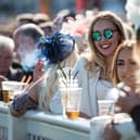 Racegoers at the Grand National Festival horse race meeting at Aintree Racecourse. Image: OLI SCARFF/AFP via Getty Images