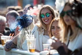 Racegoers at the Grand National Festival horse race meeting at Aintree Racecourse. Image: OLI SCARFF/AFP via Getty Images