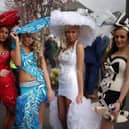 AINTREE, ENGLAND - APRIL 04:  Racegoers enjoy the party atmosphere of Ladies Day 