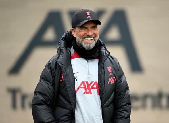 Jurgen Klopp smiles during a Liverpool training session