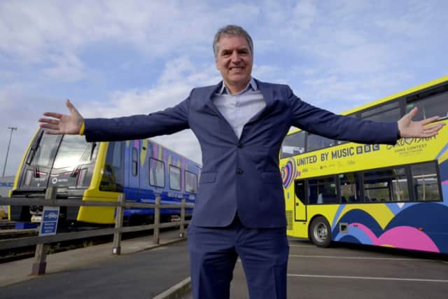 Mayor Rotheram proudly reveals the new buses and trains. Image: LCR