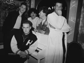 Frankie Goes To Hollywood in 1986. Singer Holly Johnson is seated by the piano, and behind him are (left to right) bassist Mark O’Toole, drummer Peter Gill, guitarist Brian Nash and singer Paul Rutherford. 