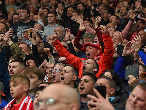 Liverpool fans go mad during the Premier League match between Liverpool and Tottenham Hotspur at Anfield.