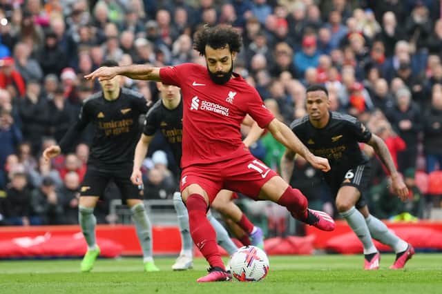 Liverpool’s Mohamed Salah shoots from the penalty spot during a match