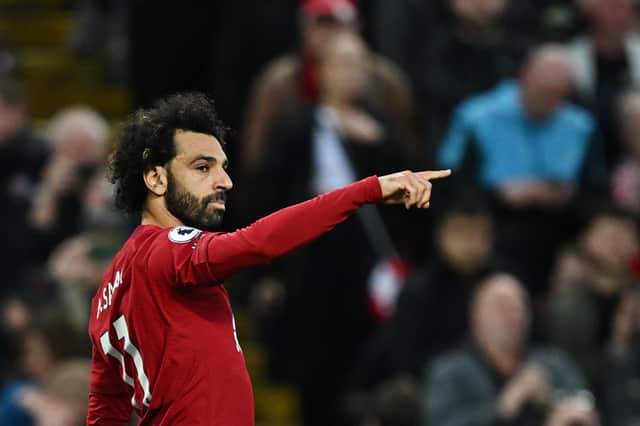 Liverpool’s Mohamed Salah gestures during a match