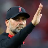 Liverpool manager Jurgen Klopp waves to fans after a match