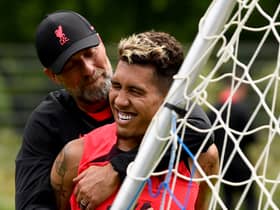 Liverpool manager Jurgen Klopp embraces Roberto Firmino. Picture: Andrew Powell/Liverpool FC via Getty Images