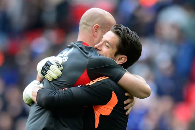 Brad Jones of Liverpool and Pepe Reina after the FA Cup semi-final win over Everton in 2012 (Photo by Shaun Botterill/Getty Images)
