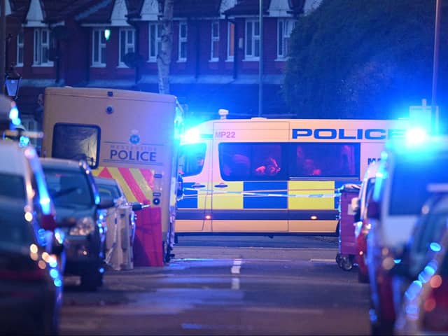 A police van is pictured at a cordon near a residential property in Liverpool. Image: OLI SCARFF/AFP via Getty Images