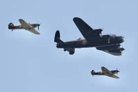 A flypast by Battle of Britain Memorial Flight planes - Lancaster Bomber, Spitfire and Hurricane.
