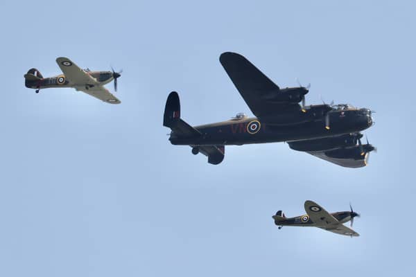 A flypast by Battle of Britain Memorial Flight planes - Lancaster Bomber, Spitfire and Hurricane.