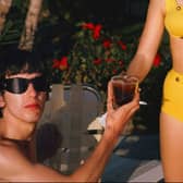 A colour photograph of George Harrison relaxing in Miami in 1964. (Picture: Instagram/@paulmccartney)