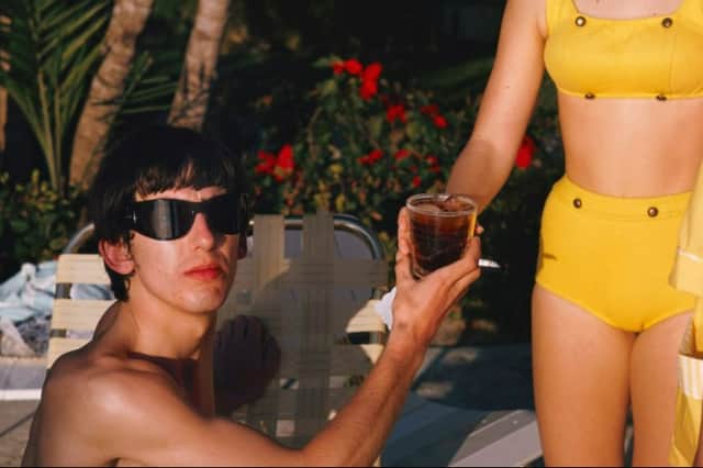 A colour photograph of George Harrison relaxing in Miami in 1964. (Picture: Instagram/@paulmccartney)
