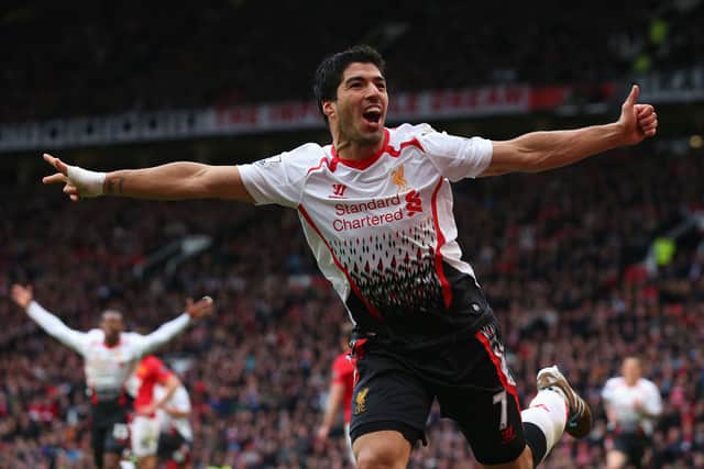 Luis Suarez of Liverpool celebrates scoring a goal