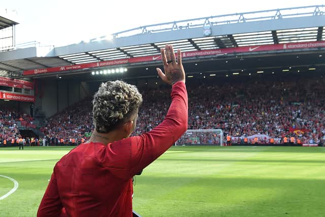 Roberto Firmino waves farewell to the Liverpool fans at Anfield