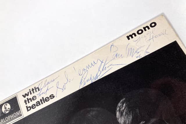 Authentic autographs from the Fab Four. Image: Omega Auctions.
