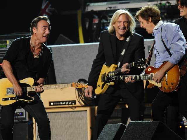Sir Paul McCartney performs with Bruce Springsteen at the end of the 54th Grammy Awards (ROBYN BECK/AFP via Getty Images)