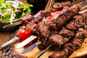 A lamb kebab on a skewer, with salad. Image: HLPhoto - stock.adobe.com