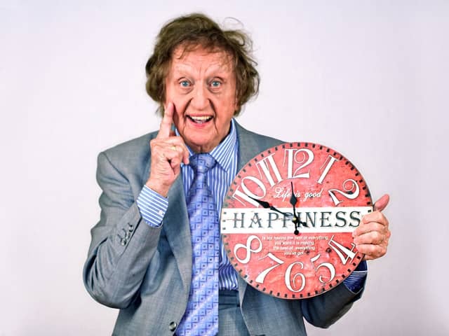 Ken with the happiness clock. Photo by Peter Rogan.