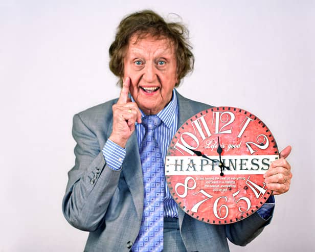 Ken with the happiness clock. Photo by Peter Rogan.