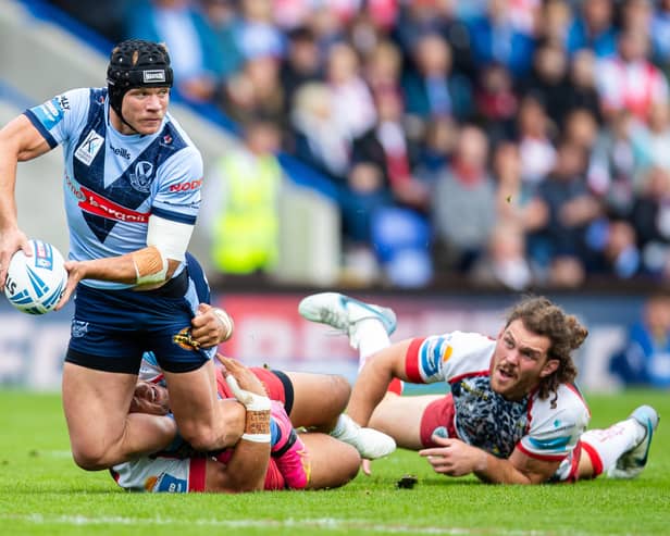 Jonny Lomax of St.Helens is tackled by John Asiata of Leigh Leopards during the Betfred Challenge Cup semi-final match between St Helens and Leigh Leopards at The Halliwell Jones Stadium.  Image: Jess Hornby/Getty Images