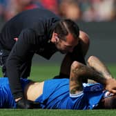Everton winger Dwight McNeil receives treatment. Picture: Matt McNulty/Getty Images