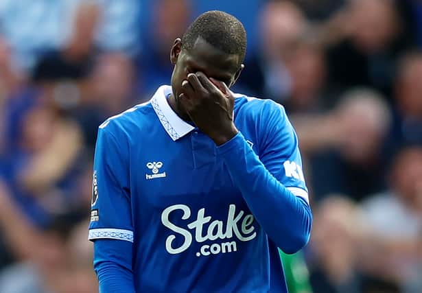 Abdoulaye Doucoure of Everton looks dejected after the team conceded the first goal during the Premier League match between Everton FC and Fulham FC at Goodison Park on August 12, 2023 in Liverpool, England. (Photo by Nathan Stirk/Getty Images)