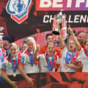 St Helens players celebrate with the trophy after winning the Betfred Women’s Challenge Cup Final match against Leeds Rhinos at Wembley Stadium. Image: Tony Marshall/Getty Images