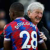 Crystal Palace midfielder Cheick Doucoure with manager Roy Hodgson. Picture: IAN KINGTON/AFP via Getty Images