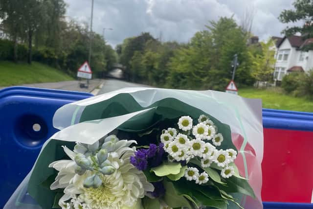 Wellwishers leave flowers at Queens Drive in the Mossley Hill where married couple Philip and Elaine Marco died. Image: Emily Bonner