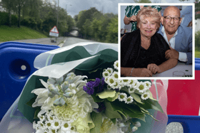Flowers are placed at the scene where Philip and Elaine Marco died in floodwater. Image: Emily Bonner/family handout