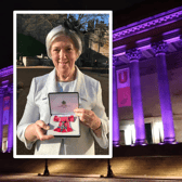 Pauline Fielding with her MBE and St George’s Hall illuminated purple: Images: Christine Fielding/RoadPeace & St Georges Hall.