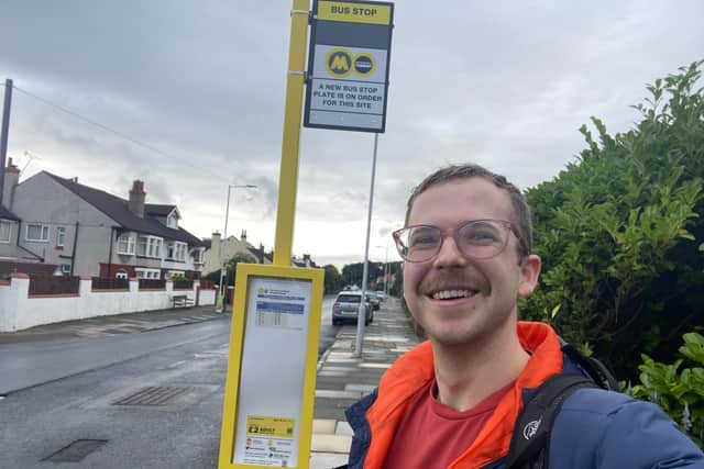 Reporter Ed Barnes at the first bus stop in Wallasey. Image: Ed Barnes