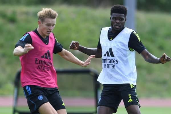 Arsenal midfielder Thomas Partey, right, and Martin Odegaard. Picture: Stuart MacFarlane/Arsenal FC via Getty Images