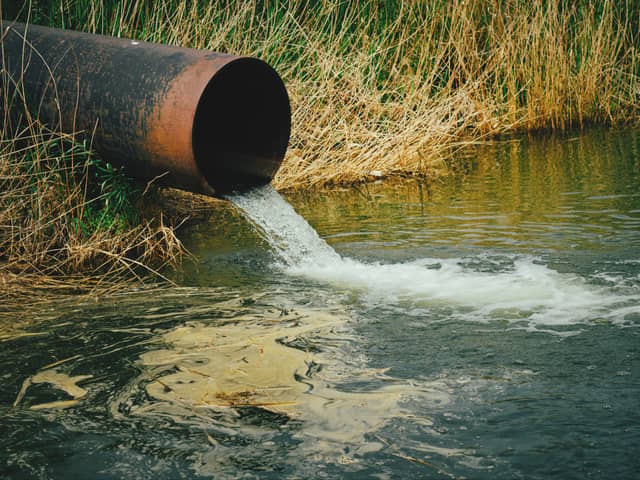 Draining sewage from pipe into river. Image: freeman83 - stock.adobe.com