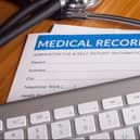 Stethoscope resting on a sheet of medical insurance records. Image: danielfela - stock.adobe.com