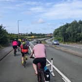 Cyclists using the controversial Fender Lane cycle route. Credit: Edward Lamb