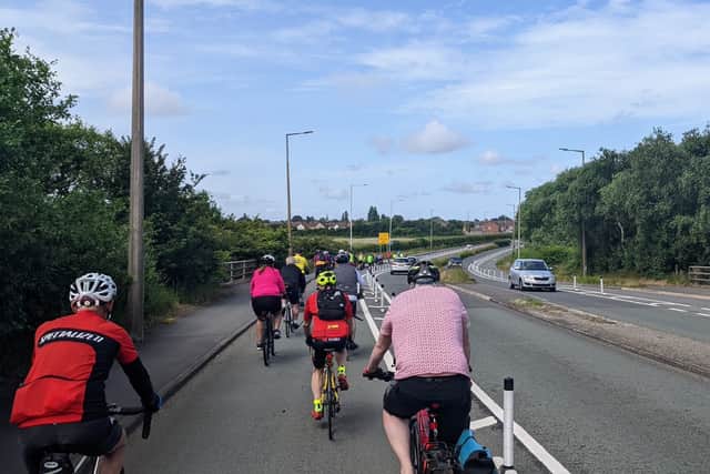 Cyclists using the controversial Fender Lane cycle route. Credit: Edward Lamb