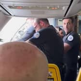 Man removed from Ryanair flight. Image: @Jostanley936/X