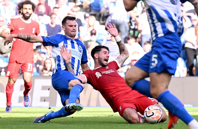  Dominik Szoboszlai of Liverpool brought down in the penalty area during the Premier League match between Brighton & Hove Albion and Liverpool FC at American Express Community Stadium on October 08, 2023 in Brighton, England. (Photo by Andrew Powell/Liverpool FC via Getty Images)