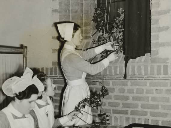 Nurses putting up Christmas decorations in their new home at St. Katherine ‘s College, Taggart Avenue, Liverpool in 1939. 