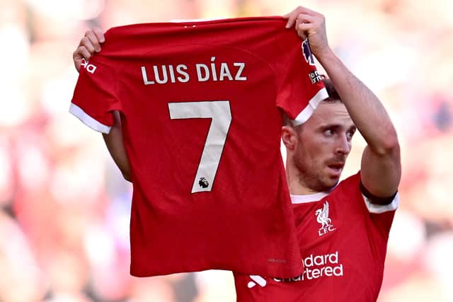 Diogo Jota of Liverpool celebrates after scoring the opening goal by holding a Luis Diaz shirt during the Premier League match between Liverpool FC and Nottingham Forest at Anfield on October 29, 2023 in Liverpool, England. (Photo by Andrew Powell/Liverpool FC via Getty Images)