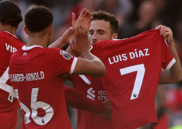Luis Diaz holds a Luis Diaz shirt after scoring in Liverpool’s win against Forest. Picture: IAN HODGSON/AFP via Getty Images