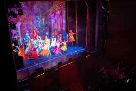 Dancers and actors in the Christmas pantomime ‘Cinderella’ perform on stage at St Helens Theatre Royal, in St Helens on December 4, 2022. Photo by OLI SCARFF/AFP via Getty Images