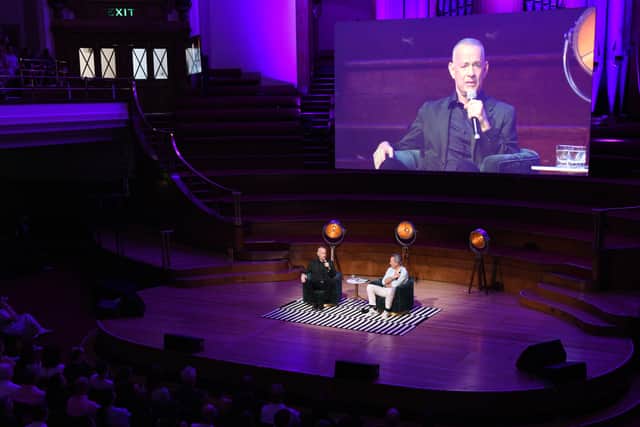 Tom Hanks speaks with Richard E. Grant during An Evening With Tom Hanks to celebrate the publication of his debut novel “The Making of Another Major Motion Picture Masterpiece” at Westminster Central Hall. Image:Nicky J Sims/Getty Images for ABA