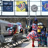 A Eurovision super-fan arrives at Lime Street Station as host city Liverpool prepares to throw a memorable party. Photo by PAUL ELLIS/AFP via Getty Images