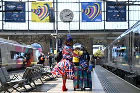 A Eurovision super-fan arrives at Lime Street Station as host city Liverpool prepares to throw a memorable party. Photo by PAUL ELLIS/AFP via Getty Images